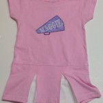 megaphone applique with Maggie in the middle on toddler cheer dress