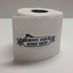 Toilet paper with Johnny Paul's Music Shop Logo embroidered on the toilet paper