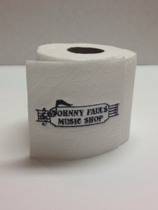 Toilet paper with Johnny Paul's Music Shop Logo embroidered on the toilet paper