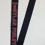 black lanyard with embroidered Texas Tech Logo and Dylan Finley