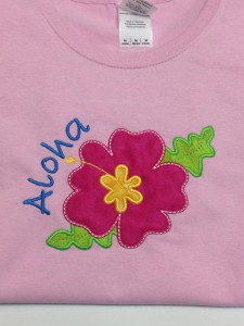 bright pink hibiscus flower for aloha party on pink tshirt